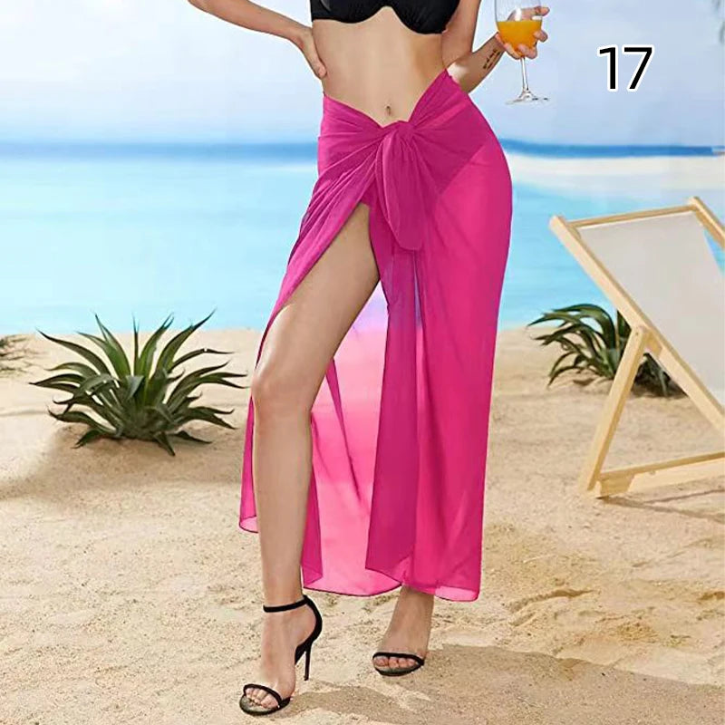 Model wearing Sexy chiffon wrap skirt pink style on a tropical beach