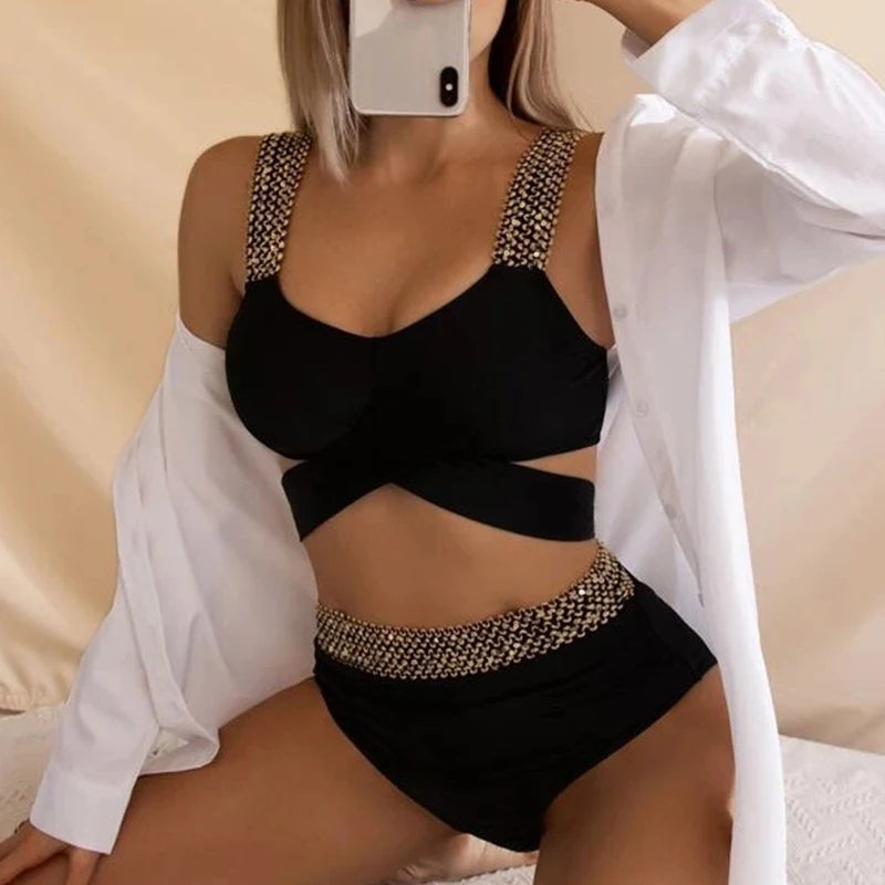 Model posing in gold patchwork high-waist bikini