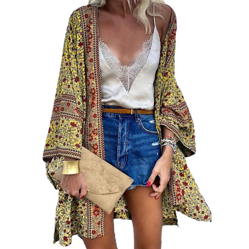 Flat lay of Women's Bohemian Floral Long-Sleeve Cardigan Cover-Up with beach essentials