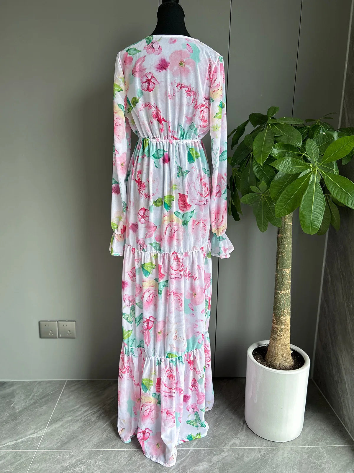 Back view of women’s bikini and floral dress beachwear set