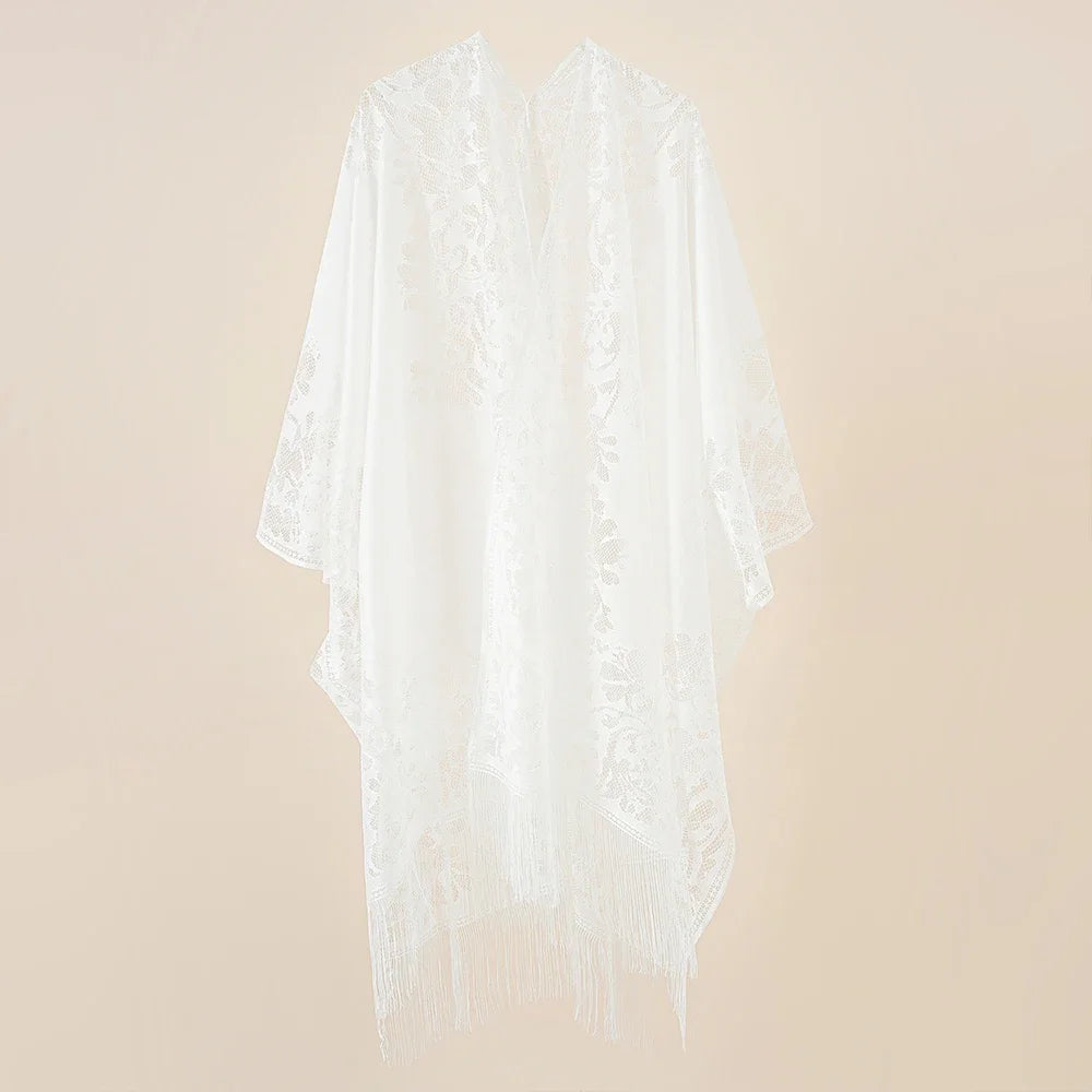 Flat lay of Women's Floral Lace Kimono Cover-Up with beach essentials