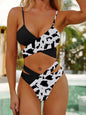 Bikini top styled in cross-wrap halter with cheeky leopard bottom  doted white and black style 