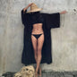 Lifestyle shot of Women's Belted Breeze Kimono Cover-Up at a tropical resort