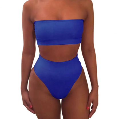Flat lay of solid color strapless bikini set with accessories