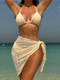 Front view of 3-piece halter bikini set with high-leg bottoms and sarong beige style 