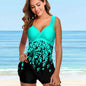 Lifestyle shot of woman in swimdress walking on beach 