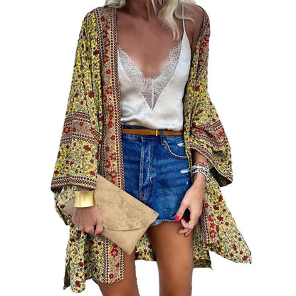 Flat lay of Women's Bohemian Floral Long-Sleeve Cardigan Cover-Up with beach essentials