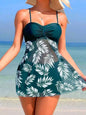 Model wearing Women's Coastal Charm green Swimsuit Dress on a sunny beach