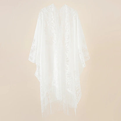 Flat lay of Women's Floral Lace Kimono Cover-Up with beach essentials