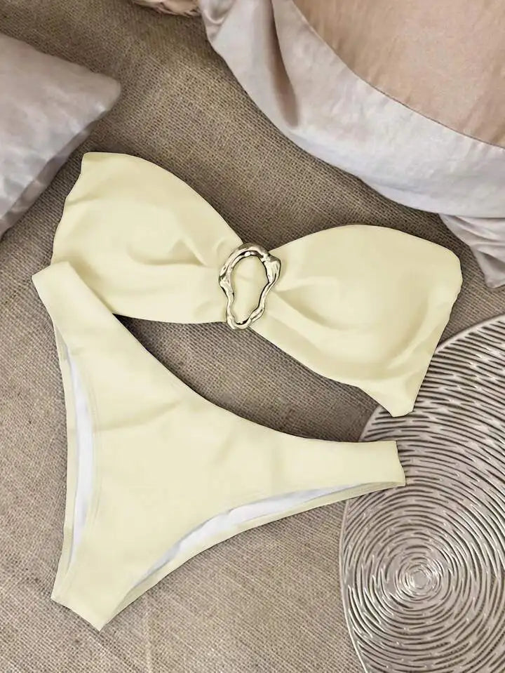 Rear view showing high-cut bikini bottoms and strapless top half white 