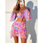 Front view of Women's Paradise Pulse Four-Piece Bikini Set with vibrant print