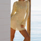 Model wearing Women's Sheer Glow Long-Sleeve Mini Dress Cover-Up on a tropical beach