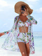 Model walking on the beach in Women's Siren Splash Three-Piece Tankini Set