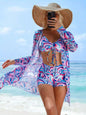  Flat lay of Women's Siren Splash Three-Piece Tankini Set with beach essentials