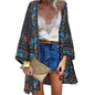 Model wearing Women's Sunlit Sheer Long Cardigan Cover-Up on a tropical beach