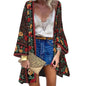 Women's Sunlit Sheer Cardigan Cover-Up worn during a sunset beach shoot