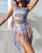 Lifestyle shot of Women's Tropical Tassel Cover-Up Dress at a tropical resort